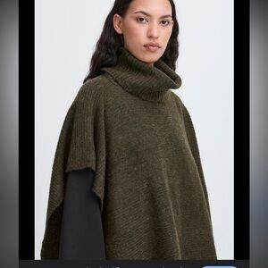 Tera Bora green alpaca/ wool blend poncho
From clothing store in France